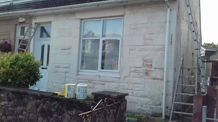 Weathered home exterior before restoration