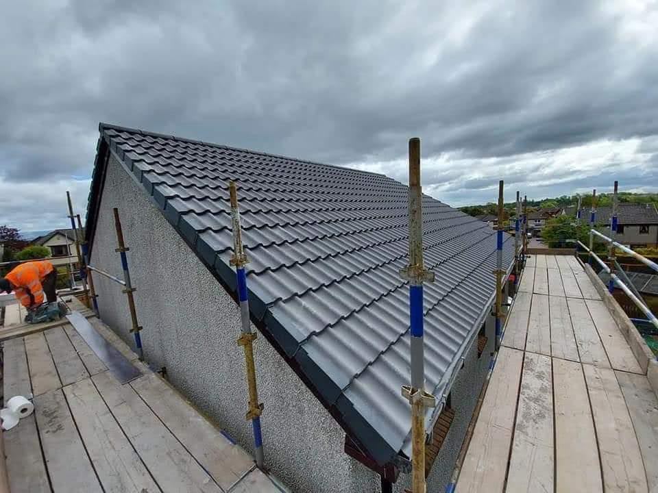 Completed dark tiled roof